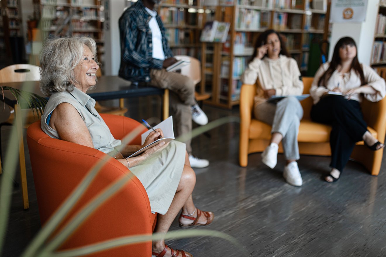 Group of Adult Students Studying in the Library 