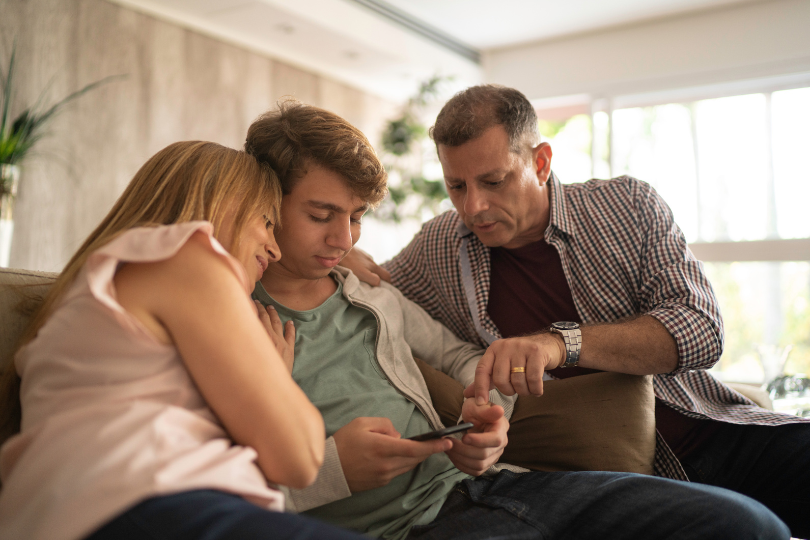 Parents having a serious conversation with teenager son