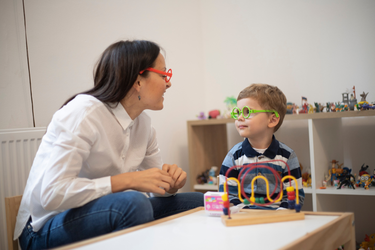 Little boy and a therapist having a play therapy class