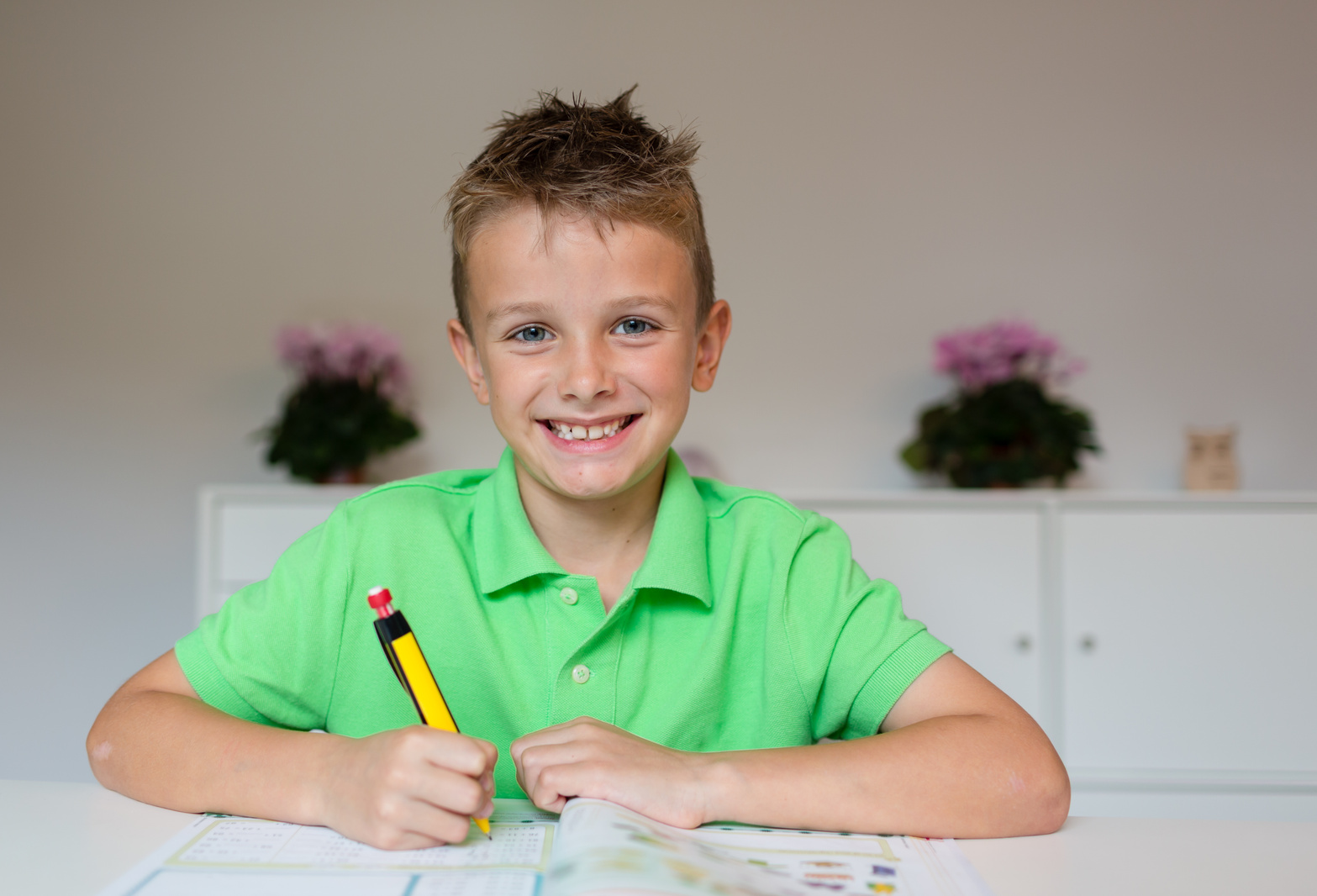 Happy boy doing homework